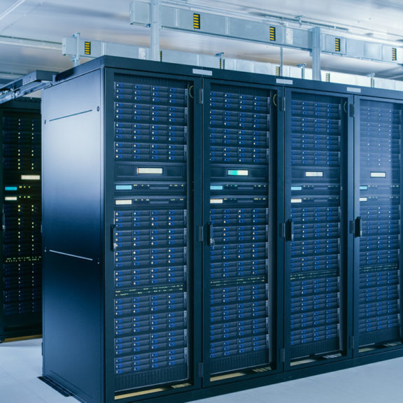 Shot of Data Center With Multiple Rows of Fully Operational Server Racks. Modern Telecommunications, Cloud Computing, Artificial Intelligence, Database, Supercomputer Technology Concept.